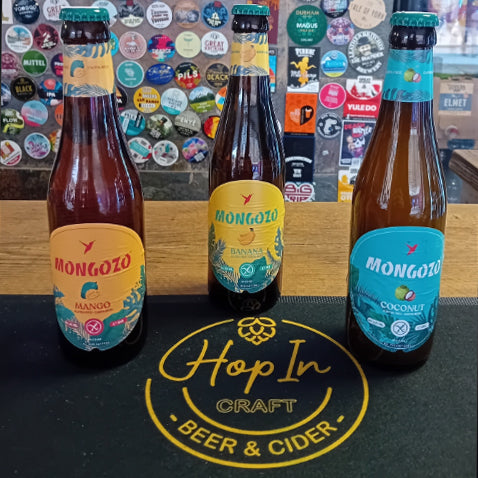 Custom branded rubber bar mat featuring a craft brewery logo in a busy UK taproom 3 bottles of beer.