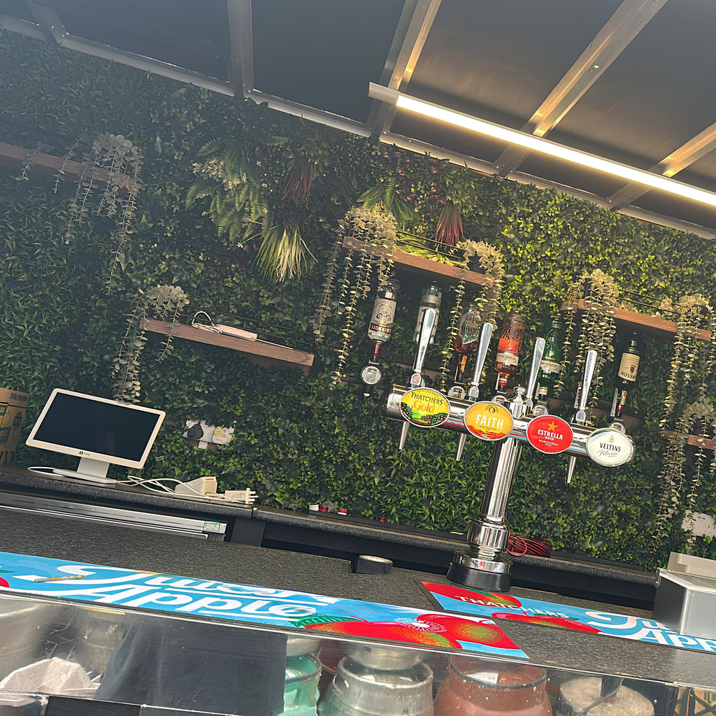 Durable non-slip bar runner on a mobile horsebox bar counter at an outdoor UK festival.