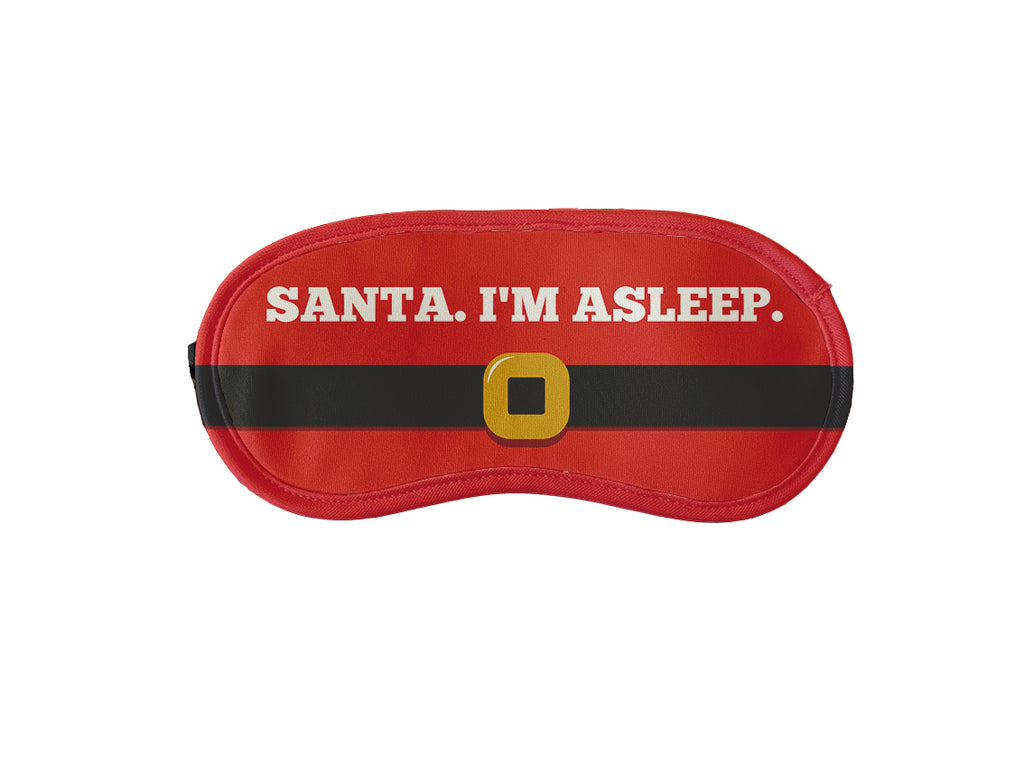 Red sleeping mask with text 'Santa. I'm asleep.' for a peaceful and festive sleep.